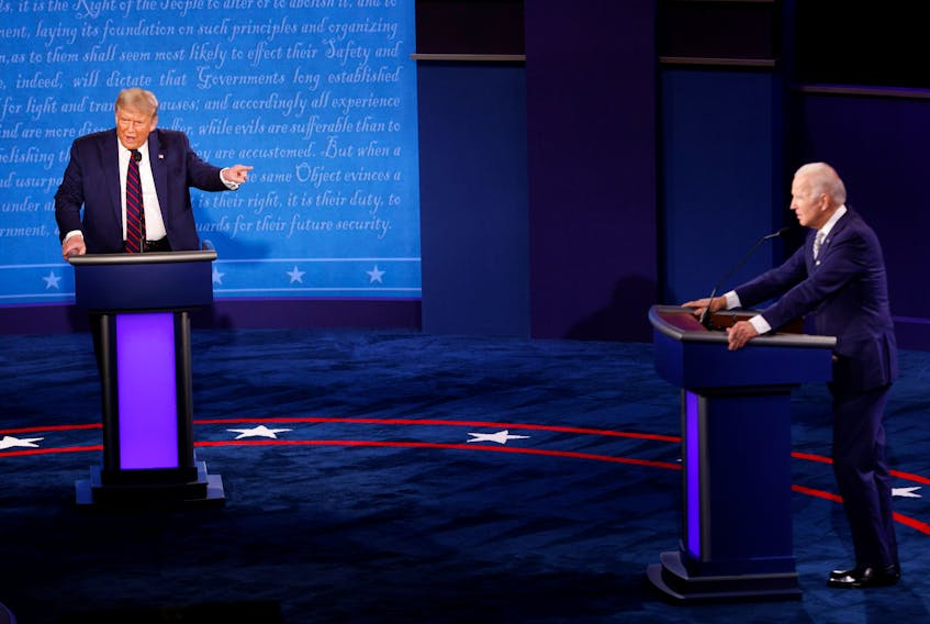 U.S. President Donald Trump and Democratic presidential nominee Joe Biden participate in their first 2020 presidential campaign debate held on the campus of the Cleveland Clinic at Case Western Reserve University in Cleveland, Ohio, on Sept. 29, 2020. - Brian Snyder / Reuters