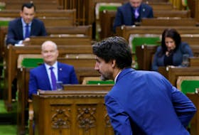 Prime Minister Justin Trudeau rises to vote on a confidence motion against his government in the House of Commons on Parliament Hill in Ottawa, on Oct. 21, 2020.
