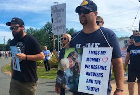 Nick Beaton (right), Kristen Beaton's husband, leads hundreds of people on a march to the RCMP detachment in Bible Hill on Wednesday, July 22, 2020, as an effort to keep the pressure on the provincial and federal governments to call a public inquiry into the mass shooting on April 18 and 19