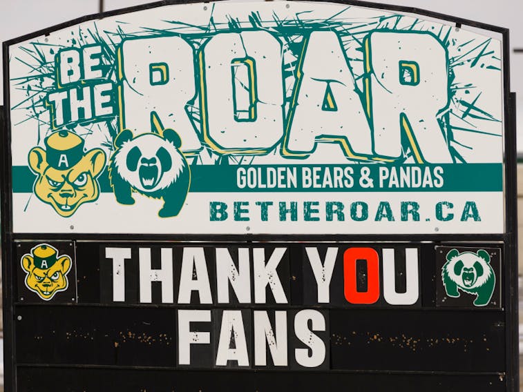 A sign near the closed Saville Community Sports Centre thanks University of Alberta Golden Bears and Pandas fans after the end of university sports play in Edmonton, on March 17, 2020.