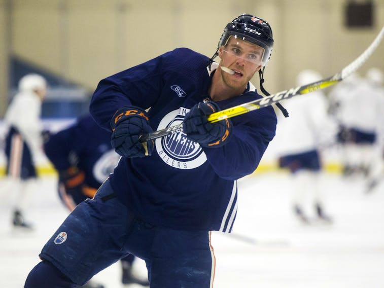 Connor McDavid (97) warms up prior to an Edmonton Oilers training camp scrimmage in Edmonton on Wednesday, July 22, 2020.