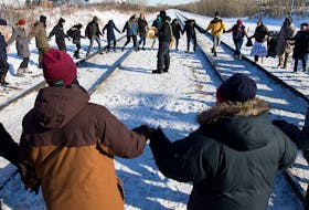 Protesters perform a round dance as they prepare to end their blockade at the CN rail line near 213 Street and 110 Avenue in solidarity with Wet'suwet'en Hereditary Chiefs, in Edmonton Wednesday Feb. 19, 2020. 