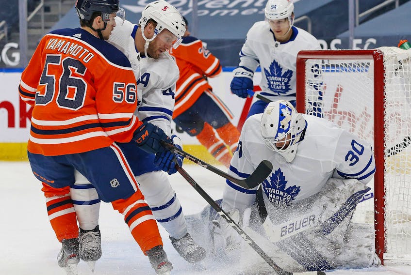 Toronto Maple Leafs goaltender Michael Hutchinson (30) makes a save against Edmonton Oilers forward Kailer Yamamoto (56) during the first period at Rogers Place. 