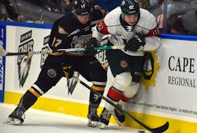 Seena Peeters of the Halifax Mooseheads, right, battles for the puck with Matthew MacDonald of the Cape Breton Eagles during Quebec Major Junior Hockey League action at Centre 200 in Sydney, Friday. JEREMY FRASER/CAPE BRETON POST