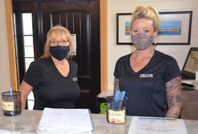 Charlene Gill, left, co-owner of Family & Friends Restaurant in Kensington, stands behind the restaurant's counter with server Courtney Crosby. Both women are concerned over the upcoming P.E.I. Vax Pass policy, particularly how the business will manage enforcement with so many part-time staff in school and an ongoing labour shortage.
