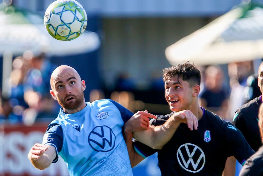 Halifax Wanderers Jeremy Gagnon-Lapare and Pacific FC's Alessandro Hojabrpour, battle for the ball during 2nd half CPL action at the Wanderers Grounds Monday October 11, 2021. The Wanderers defeated the CPL's top club, 1-0.

TIM KROCHAK PHOTO