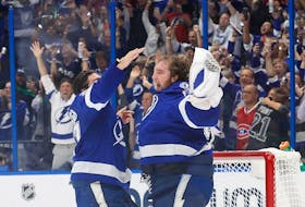 Tampa Bay Lightning goaltender Andrei Vasilevskiy (88) and defenceman Ryan McDonagh (27) celebrate after defeating the Montreal Canadiens 1-0 in Game 5 to win the 2021 Stanley Cup Final at Amalie Arena. Vasilevskiy won the Conn Smythe Trophy as playoff MVP. 