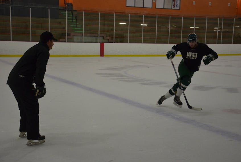 UPEI Panthers associate coach Darryl Boyce watches defenceman Conor MacEachern go through a skating drill at a recent practice. The Panthers return to action at MacLauchlan Arena in the Atlantic University Sport Men's Hockey Conference against the St. Francis Xavier X-Men on Oct. 15 at 7 p.m.