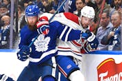  Maple Leafs’ Jake Muzzin (left) battles on the boards with Montreal Canadiens’ Josh Anderson during Wednesday’s game in Toronto. DAN HAMILTON/USA TODAY SPORTS