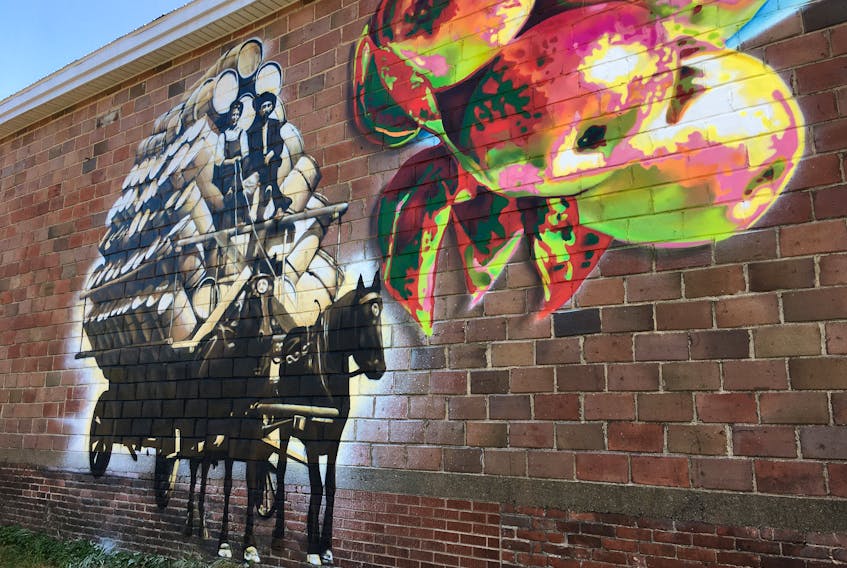 The Berwick Mural Society’s first project shows a team of horses hauling a wagon full of apple barrels.