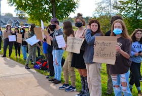 Students from Avon View High School in Windsor protested on the sidewalk on Wentworth Road on Oct. 12, calling on school administration to do more to address the problem of sexual assaults. KIRK STARRATT