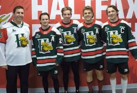 Halifax Mooseheads captain Elliot Desnoyers, far right, poses with, from left to right, CFB Halifax base commander Sean Williams and assistant captains Zach Beauregard, Stephen Davis and Zachary L'Heureux.