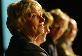 NDP incumbent Alexa McDonough smiles as she is asked a question seated next to Liberal candidate Sheila Fougere, Green party candidate Michael Oddy and Conservative candidate Kevin Keefe during a 2004 campaign debate at Dalhousie University in Halifax.
