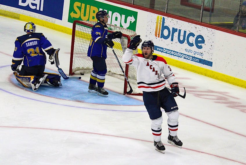 Acadia Axemen forward Nick Deakin-Poot celebrates after scoring a shorthanded goal during the second intermission of the Oct. 15 game with Moncton.