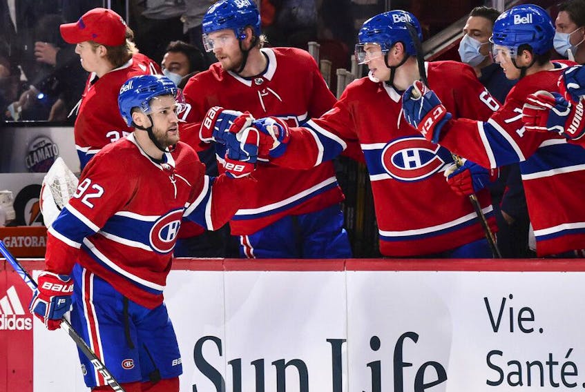 Canadiens' Jonathan Drouin (92) celebrates his goal with teammates on the bench against the New York Rangers during the third period at the Centre Bell on Saturday, Oct. 16, 2021, in Montreal.