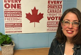 Christina McKay, a Halifax high school teacher, is seen with a Student Vote poster behind her. McKay says fixed summer provincial elections will greatly reduce the impact of the Student Vote program in Nova Scotia schools.