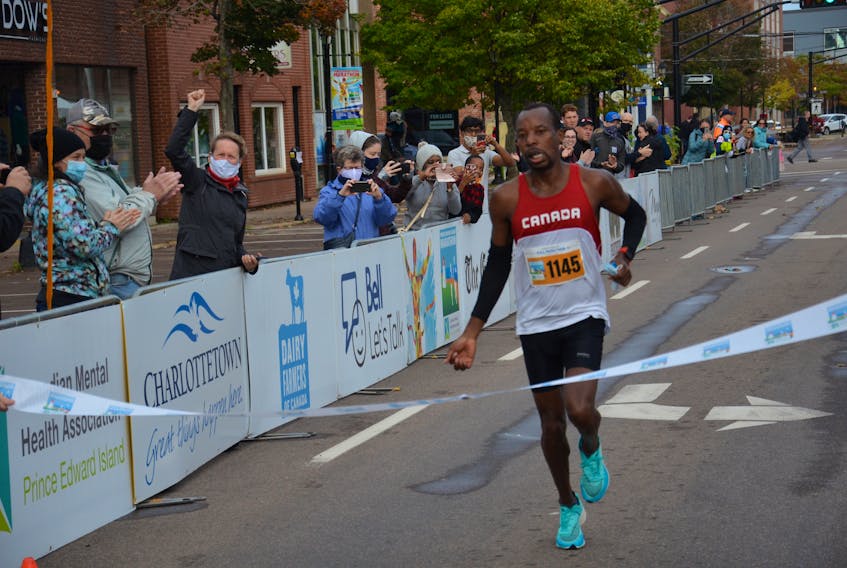Dennis Mbelenzi of Halifax crosses the finish line in the Prince Edward Island Marathon on Oct. 16. Mbelenzi set a new record if two hours 30 minutes 23 seconds (2:30:23) for the 42.2-kilometre full marathon.