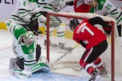 Senators winger Brady Tkatchuk (7) looks for a loose puck following a save by Stars goalie Anton Khudobin (35) during the last meeting between the two teams in February 2020. Tkachuk re-signed with the Senators on Thursday, but as of Saturday was not expected to make his season debut until later this coming week.
