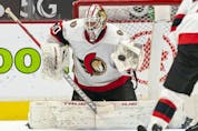  Goalie Matt Murray of the Ottawa Senators makes a glove save against the Vancouver Canucks during the third period of NHL action at Rogers Arena on April 22, 2021 in Vancouver, Canada.