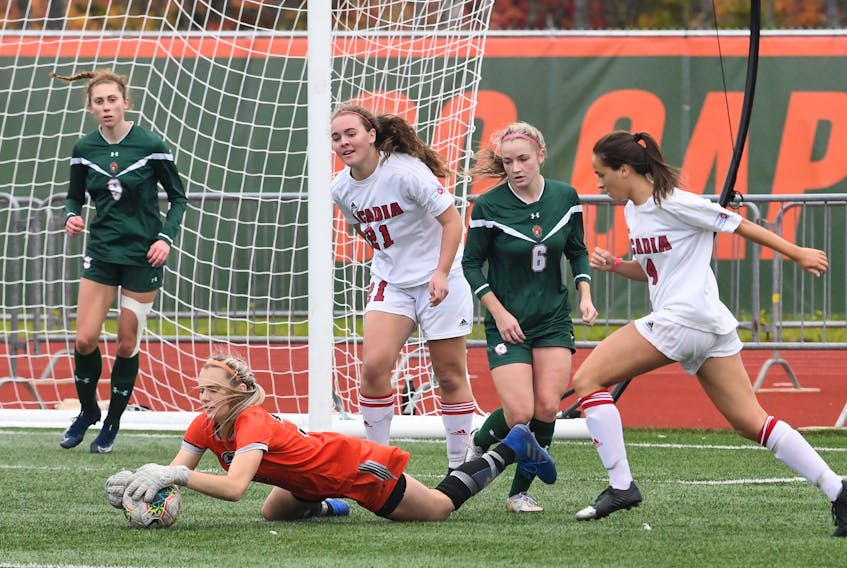 Cape Breton University keeper Haley Kardas pounces on a rebound late in the game to preserve the Capers 2-1 victory over Acadia Axewomen in Atlantic University Sports women’s soccer action Sunday at the Cape Breton Health Recreation Complex. CONTRIBUTED • VAUGHAN MERCHANT, CBU ATHLETICS