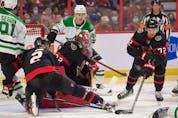  Ottawa Senators defenceman Thomas Chabot (72) clears the puck following a save by goalie Filip Gustavsson (32) in the second period against the Dallas Stars at the Canadian Tire Centre on Sunday.