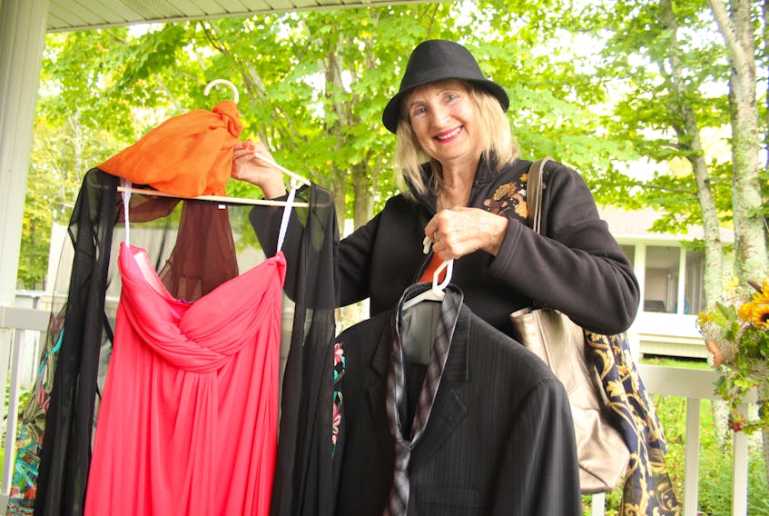 Mary Curran, one of the organizers of the annual PCH Auxiliary Clothing Sale, shows off some of her own donations to the popular charitable event. In an effort to deal with the backlog of clothes caused by the cancellation of last year’s event, the auxiliary has cut all its prices for the 2021 edition, which starts Oct. 20. 