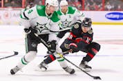  Miro Heiskanen #4 of the Dallas Stars battles for the puck with Tim Stuetzle #18 of the Ottawa Senators during the third period at Canadian Tire Centre on Sunday.