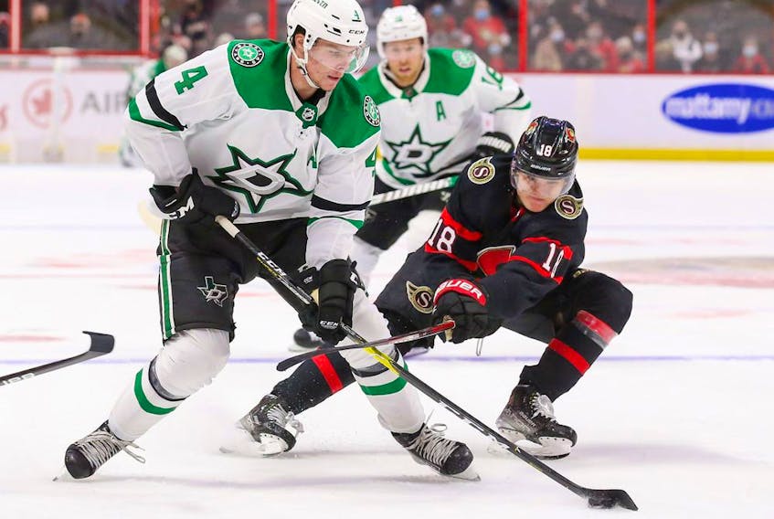  Miro Heiskanen #4 of the Dallas Stars battles for the puck with Tim Stuetzle #18 of the Ottawa Senators during the third period at Canadian Tire Centre on Sunday.
