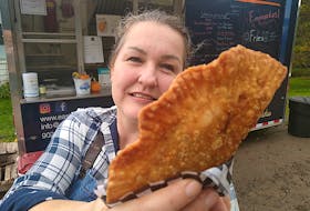 Bettina Hartenstein of South Haven stands outside her family’s food truck, East Coast Empanadas, with a sample of the original Latin American street food they offer. During the Cabot Trail Food Truck Rally on Saturday and Sunday, East Coast Empanadas will be set up at the Wreck Cove General Store. Contributed