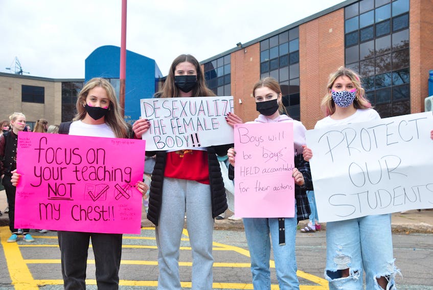 Students, from left, Reegan Perry, Maggie Powers, Abby Rogerson and Kennedy Curley helped organize a walkout at Charlottetown Rural High School on Oct. 19 after getting frustrated with what they say is a lack of response to their complaints from school administration.
