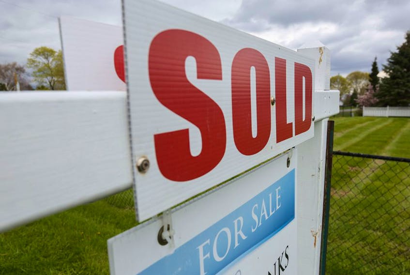 A sold sign is seen outside a house in the tourist destination of Prince Edward County, Ont.