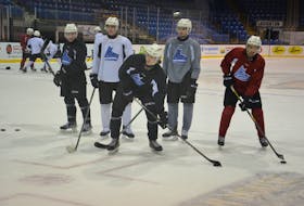Charlottetown Islanders forward Sam Bowness works on his shooting with some teammates at the end of practice at Eastlink Centre on Oct. 19. The Quebec Major Junior Hockey League team recalled Bowness, who’s from Clyde River, earlier this week from the Mount Academy under-18 team.