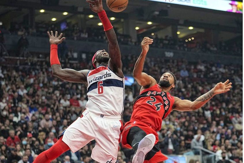Washington Wizards center Montrezl Harrell (6) and Toronto Raptors center Khem Birch (24) fight for a rebound during the first half at Scotiabank Arena.