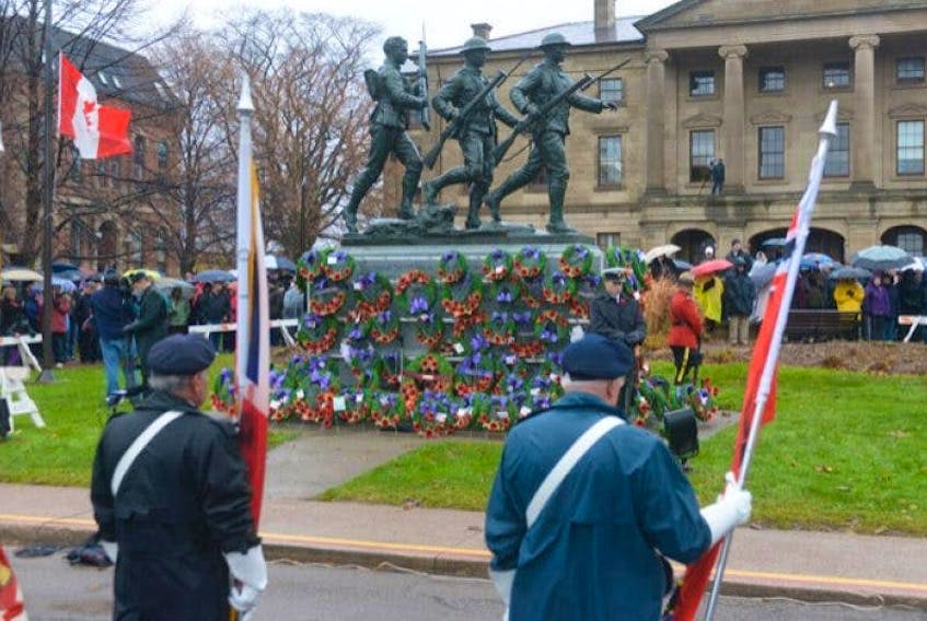 The Royal Canadian Legion colour party stands in front of the cenotaph in Charlottetown during a Remembrance Day ceremony. 