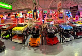 An amazing collection of historic signs form the backdrop for classic cars displayed in the neon mancave built by friends Jeff Budnick and Danny Amoroso. Contributed/Jeff Budnick