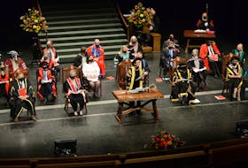 Memorial University of Newfoundland chancellor Susan Dyer Knight(right) speaks to graduates during the first convocation ceremony for the university since the fall of 2019.
