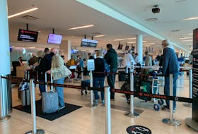 Travellers line up to check in for flights at  Halifax Stanfield International Airport the Friday before Thanksgiving. Stuart Peddle - The Chronicle Herald