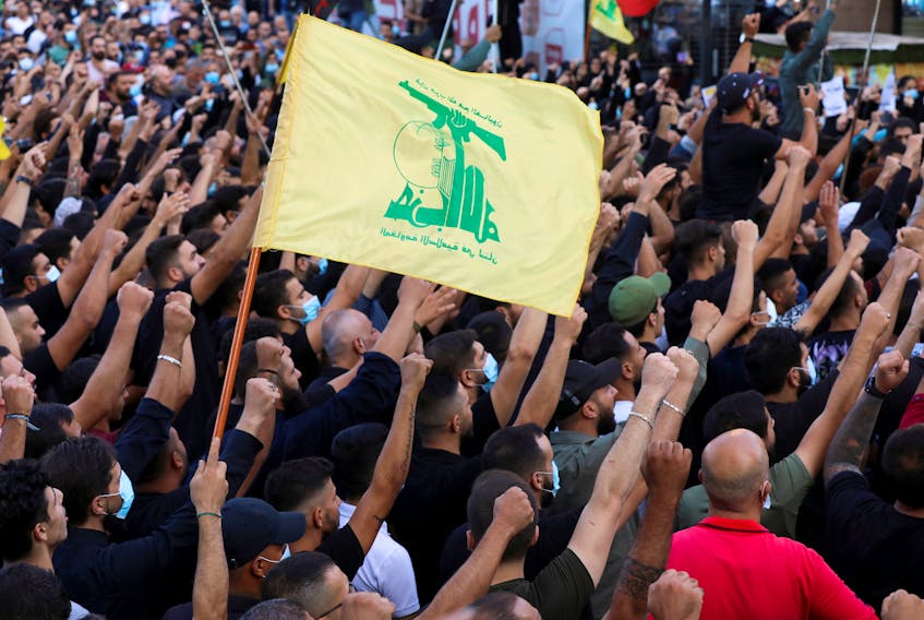 Supporters of Lebanon's Hezbollah attend a funeral of people who were killed in recent violence in Beirut in Beirut’s southern suburbs Oct. 15. 