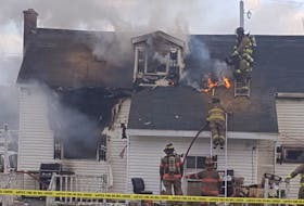 Fire crews battle a house blaze on Maxie Street in Glace Bay on Sunday. One person was taken hospital with undisclosed injuires. CONTRIBUTED