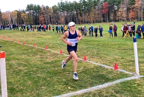Gorsebrook Junior High School's Alexander Bouchard crosses the finishes line to win the intermediate boys' race at the NSSAF cross-country championship at Osprey Ridge Golf Course in Bridgewater on Monday.