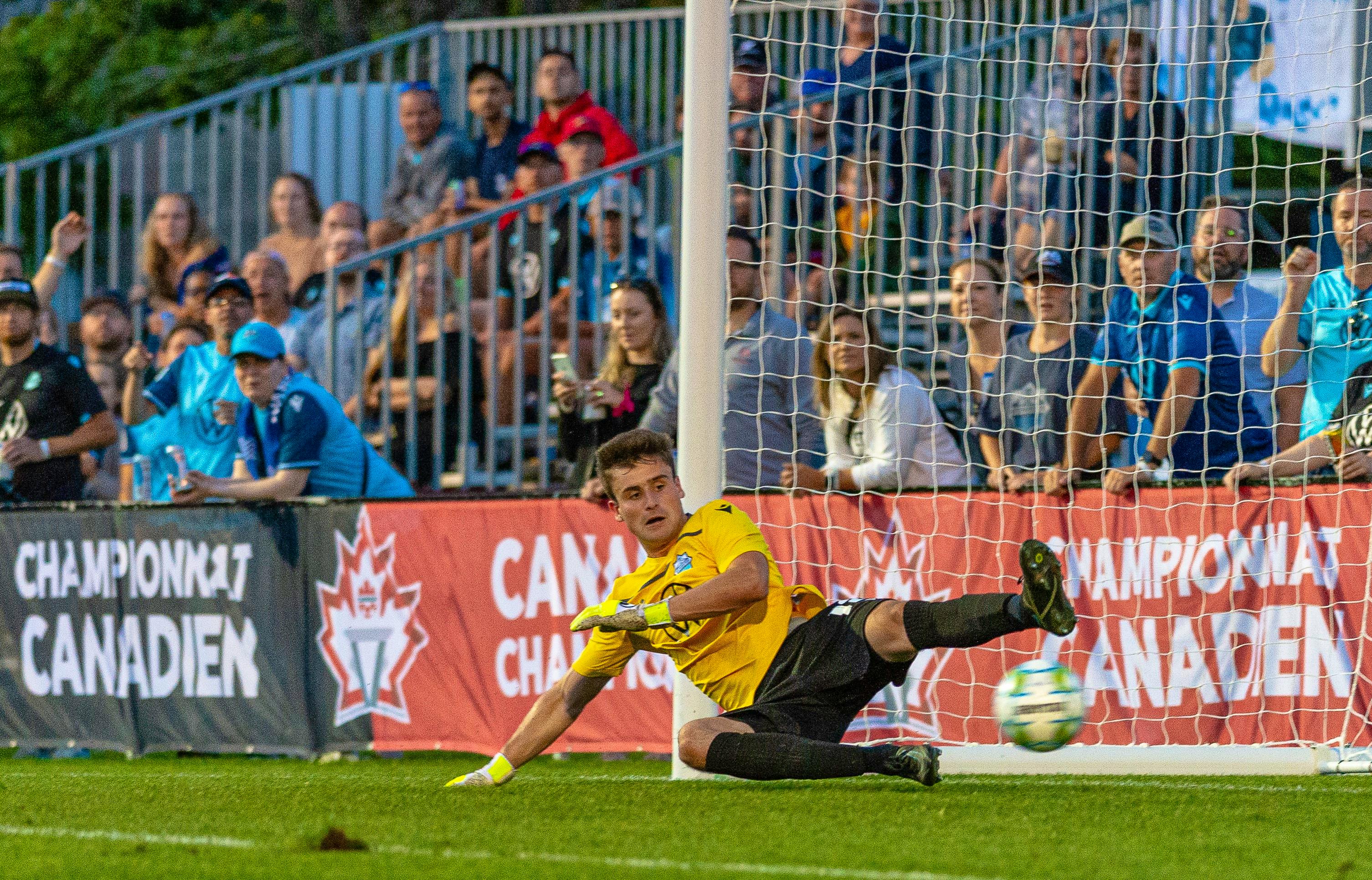 Kieran Baskett slides to make a stop during the HFX Wanderers’ Canadian Championship preliminary match against AS Blainville on Aug. 17, The match marked the professional debut of the keeper from Halifax. - TREVOR MacMILLAN / CANADIAN PREMIER LEAGUE