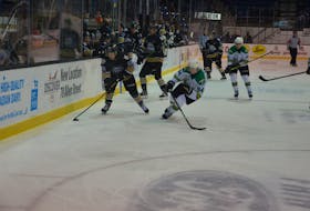 Charlottetown Islanders forward Matis Ouellet carries the puck into the offensive zone while under pressure from the Val-d’Or Foreurs’ Nathan Bolduc, 94. Charlottetown outscored Val-d'Or 7-5 in the Quebec Major Junior Hockey League game played at the Eastlink Centre on Oct. 24.