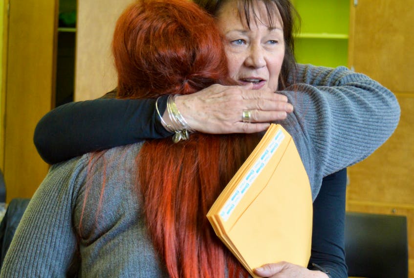 In this file photo, Ann McPhee from the Ann Terry Society in Sydney hugs Jenna Wall after Wall completed the society's women's transition to employment program in May 2019. McPhee was one of six people presented with a Women of Substance award on Oct. 18. CAPE BRETON POST 