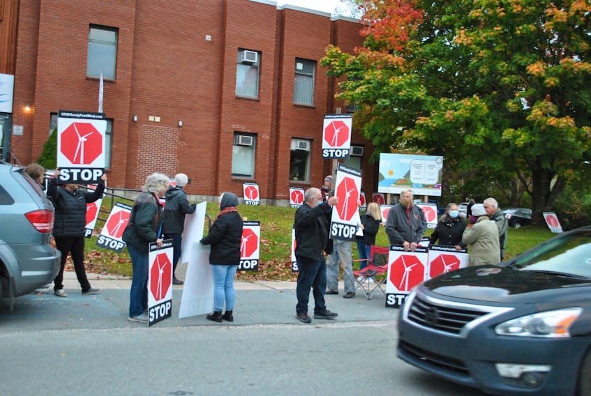 About 20 'Stop Sandy Point Wind' effort supporters rally outside the Shelburne Municipal Building on Oct. 20. The group had asked Shelburne Municipal Council to revoke a letter of support in principle they had written for the proponents of a proposed wind farm in Sandy Point. Council decided the letter will stand. KATHY JOHNSON