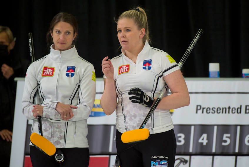 Skip Suzanne Birt left, and Marie Christianson discuss a shot during Draw 1 at the Home Hardware Canadian Curling Pre-Trials at the Queens Place Emera Centre in Liverpool on Monday. Michael Burns/ Curling Canada