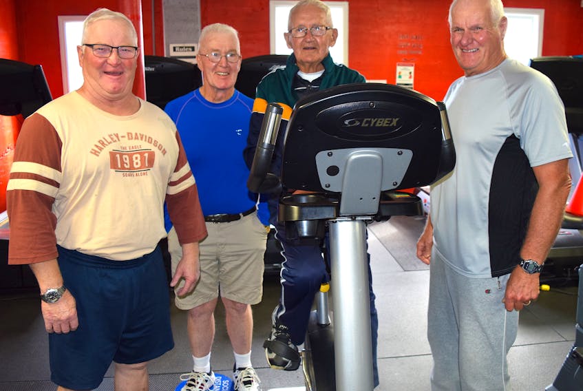 Camey Darroch, centre, 89, of New Waterford, works out on an exercise bike at Wil-Tones Family Fitness on Smith Street in New Waterford surrounded by his gym buddies of more than 20 years including, from the left, Paul (Red) Cormier, 66, Duncan (Buller) MacKenzie, 78, and Joe Aucoin, 75. Darroch says he loves the gym for not only health reasons but also the camaraderie you find there. Sharon Montgomery-Dupe/Cape Breton Post