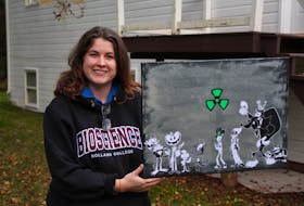 Alicia Fleming holds character design art drawn by her business partner, Joseph-Patrick Dalton. Fleming is writing on a 10-part animated series which she plans to pitch to a streaming service.