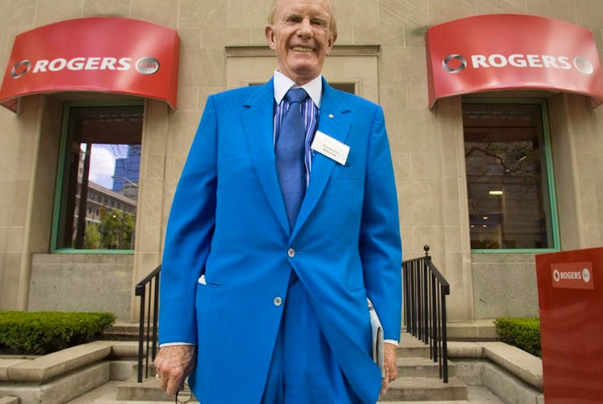  Ted Rogers poses for a photograph outside a Rogers store following the company’s annual general meeting in Toronto, in 2007.