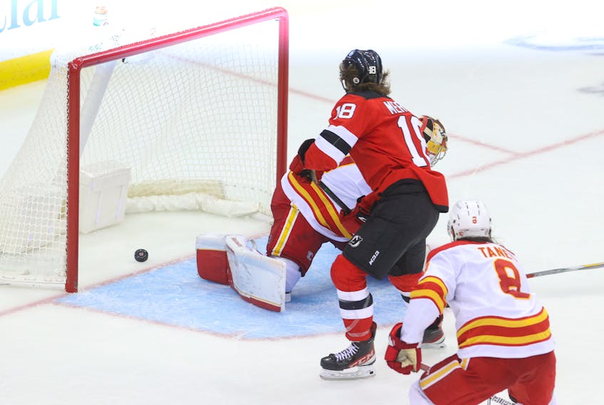 New Jersey Devils center Dawson Mercer (18) scores a goal on Calgary Flames goaltender Dan Vladar (80) during the third period at Prudential Center, Tuesday, Oct. 26, 2021. (USA TODAY Sports)