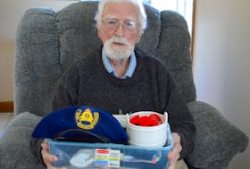 Second World War veteran Ray MacKay holds a box containing some of the many poppies he’s worn over the years and his service beret. MacKay said the poppy, which celebrates its centennial this year, is an important symbol of remembrance. “It shows respect,” he said, “but you only see it on Remembrance Day.” Chris Connors • Cape Breton Post